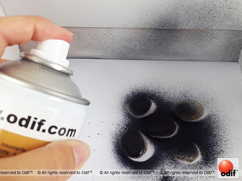 Paint the black pebbles 